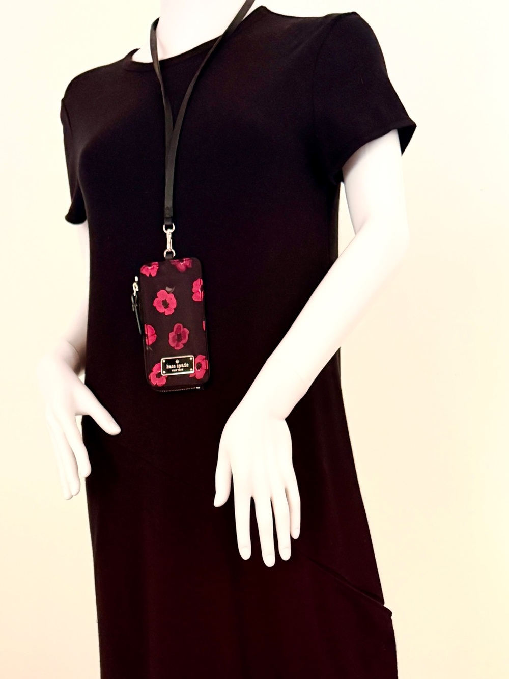 NWT. Kate Spade mini poppy design with lanyard.